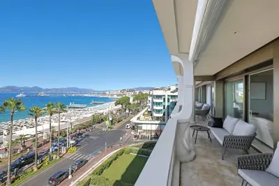 a balcony with a view of the ocean at REF 1991 - Cannes Croisette - Sea view apartment for rent in Cannes