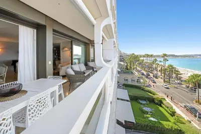 a balcony with a view of the ocean at REF 1991 - Cannes Croisette - Sea view apartment for rent in Cannes