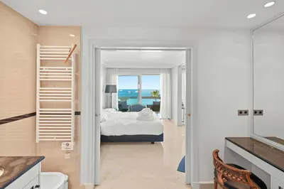 a bedroom with a bed and a view of the ocean at REF 1991 - Cannes Croisette - Sea view apartment for rent in Cannes