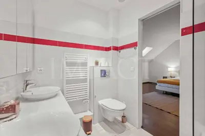 a white bathroom with a toilet and a sink at REF 1994 - Cannes Croisette - 5 mins to the Palais in Cannes