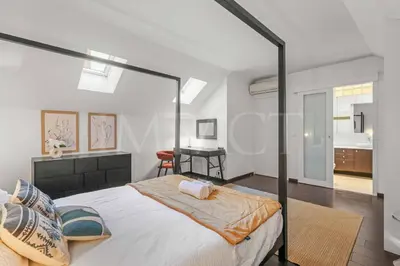 a bedroom with a large bed and a desk at REF 1994 - Cannes Croisette - 5 mins to the Palais in Cannes