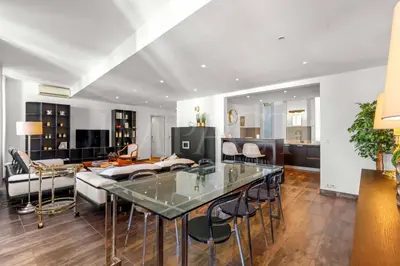a living room with a glass table and chairs at REF 1994 - Cannes Croisette - 5 mins to the Palais in Cannes