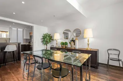 a dining room with a glass table and chairs at REF 1994 - Cannes Croisette - 5 mins to the Palais in Cannes