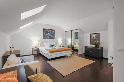 a bedroom with a bed and a living room at REF 1994 - Cannes Croisette - 5 mins to the Palais in Cannes