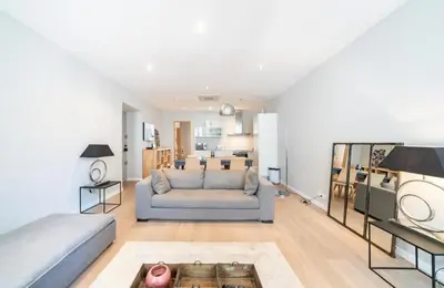 a living room with a couch and a table at Appartement Cannes, Majestic in Cannes