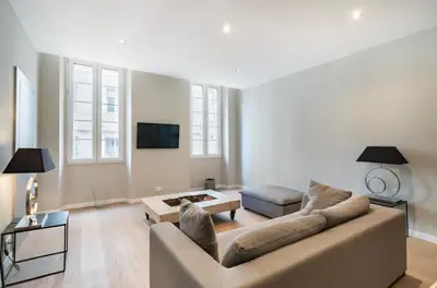 a living room with a couch and a table at Appartement Cannes, Majestic in Cannes