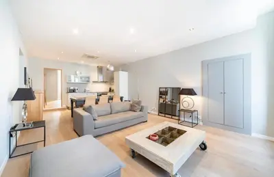 a living room with a couch and a table at Appartement Cannes, Majestic in Cannes