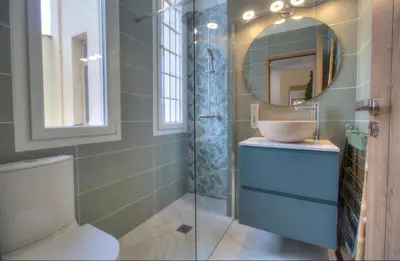 a bathroom with a toilet and a sink and a mirror at Cannes centre rue d'antibes et palais in Cannes