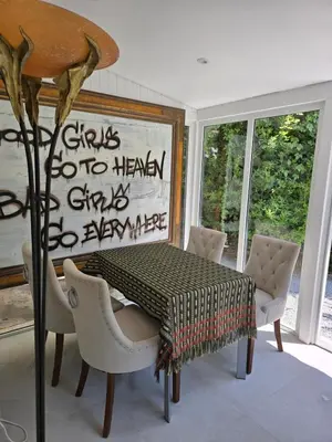 a dining room with a table and chairs at 1-Bedroom guesthouse with pool access in Cannes