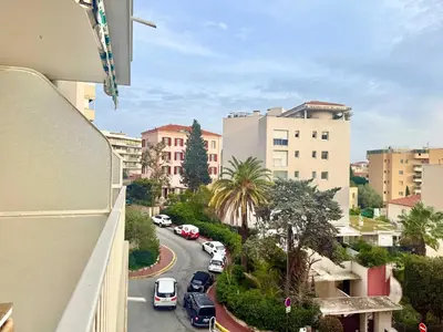 a view from a balcony of a city street with cars at B020- Elegante et lumineux a deux pas plages et centre in Cannes