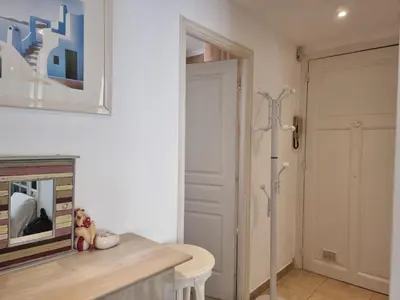 a bathroom with a toilet and a shower stall at Ferrié Plage Palais Cannes in Cannes