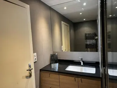 a bathroom with a sink and a mirror at Gray D'albion Cannes centre , 1 min des plages in Cannes
