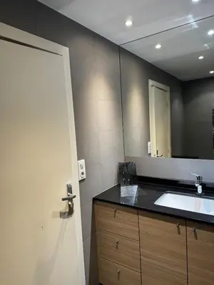 a bathroom with a sink and a mirror at Gray D'albion Cannes centre , 1 min des plages in Cannes