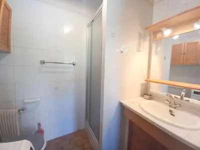 a bathroom with a sink and a shower at Trident G in Cannes