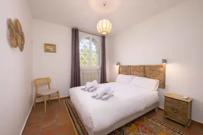 a living room with a couch and a table at Villa Lou San Peyre in Le Cannet