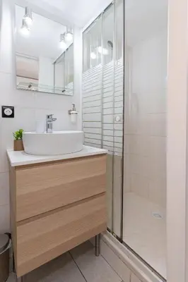 a bathroom with a sink and a shower at Modern 2 Rooms in the heart of Cannes in Cannes