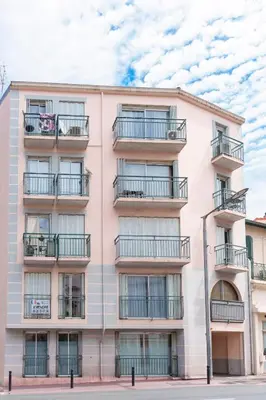 an apartment building with balconies on a street at Modern 2 Rooms in the heart of Cannes in Cannes