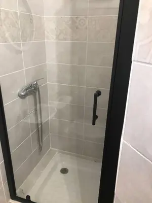 a shower with a glass door in a bathroom at Villa cannoise en bord de mer in Cannes