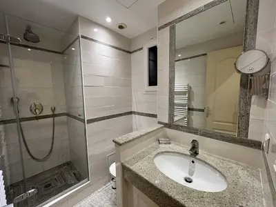 a bathroom with a sink and a shower at Cannes La Croisette - Studio face mer avec chambre cabine et balcon in Cannes