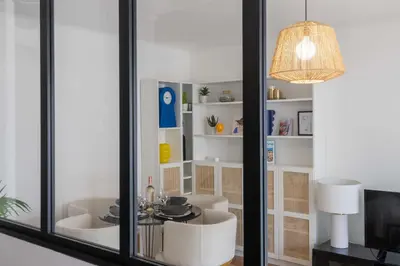 a room with white furniture and a large window at 1-Br with Terrace Palm Beach Close to Beaches in Cannes
