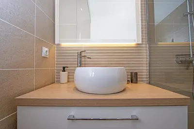 a bathroom with a white sink on a counter at Joli deux pièces - Quartier Pointe Croisette - EC in Cannes