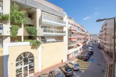 a city street with cars parked in a parking lot at Joli deux pièces - Quartier Pointe Croisette - EC in Cannes