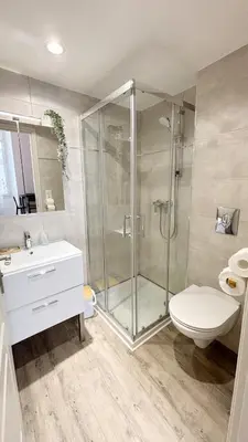 a bathroom with a shower and a toilet and a sink at Proche Palais Des Festivals, T2 avec Mezzanine - Palmazur Vacances in Cannes