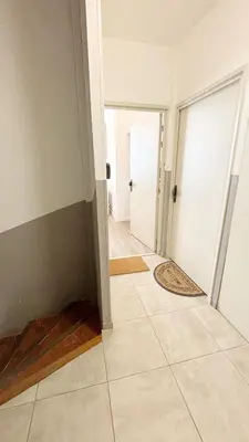 an empty room with a hallway with a tile floor at Proche Palais Des Festivals, T2 avec Mezzanine - Palmazur Vacances in Cannes