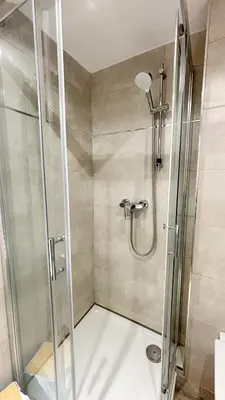 a shower with a glass door in a bathroom at Proche Palais Des Festivals, T2 avec Mezzanine - Palmazur Vacances in Cannes