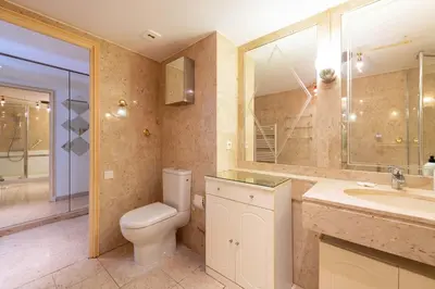 a bathroom with a toilet and a sink and a mirror at 2-Br Apartment Residence with Pool Near La Croisette in Cannes