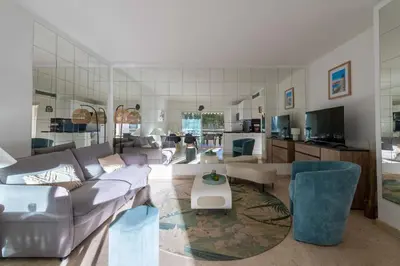 a living room with a couch and a table at 2-Br Apartment Residence with Pool Near La Croisette in Cannes