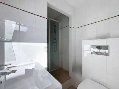 a white bathroom with a toilet and a shower at SUPERBE STUDIO Marché Forville in Cannes