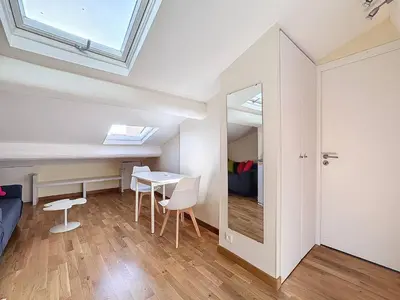a small room with a table and a mirror at SUPERBE STUDIO Marché Forville in Cannes