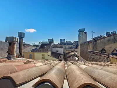 a view of the roofs of an old building at SUPERBE STUDIO Marché Forville in Cannes