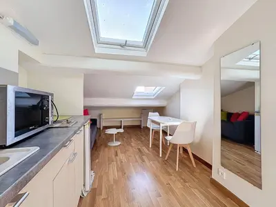 a kitchen and dining room with a skylight at SUPERBE STUDIO Marché Forville in Cannes