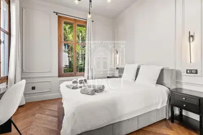 a white bedroom with a bed and a desk and a window at Cannes Villa - 2167 - Impact Center in Cannes