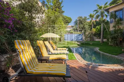 two lounge chairs and an umbrella next to a pool at Cannes Villa - 2167 - Impact Center in Cannes