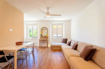 a living room with a couch and a table at 3 Chambres - Central - Plage à 10 min - Lumineux in Cannes
