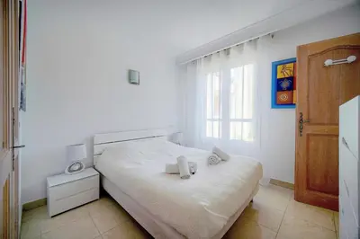 a bedroom with a bed with two towels on it at Lumineux 3 chambres TERRASSE PISCINE PARKING A3B134 in Cannes