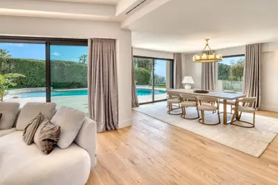 a living room with a couch and a dining room table at REF 2144 - Cannes Californie- Villa for rent in Cannes