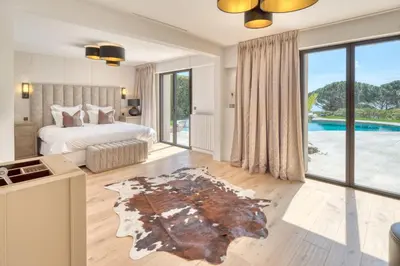 a bedroom with a bed and a pool at REF 2144 - Cannes Californie- Villa for rent in Cannes