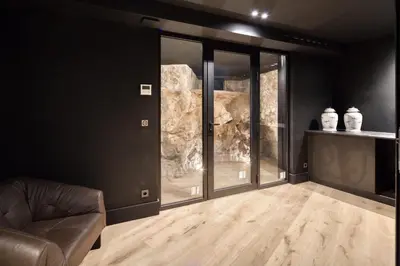 a living room with a couch and some glass doors at REF 2144 - Cannes Californie- Villa for rent in Cannes