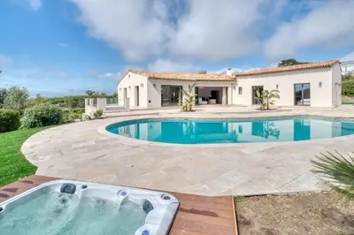 a villa with a swimming pool and a house at REF 2144 - Cannes Californie- Villa for rent in Cannes