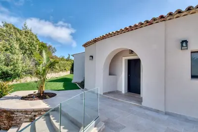 a villa with a glass staircase leading to a house at REF 2144 - Cannes Californie- Villa for rent in Cannes