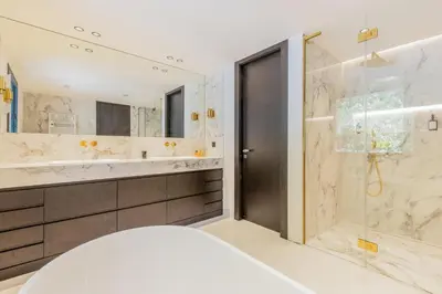 a bathroom with a shower and a glass door at Villa Cannes superbe vue mer in Cannes