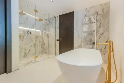 a bathroom with a white toilet and a shower at Villa Cannes superbe vue mer in Cannes