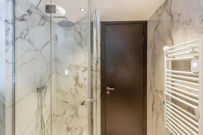 a shower with a glass door in a bathroom at Villa Cannes superbe vue mer in Cannes