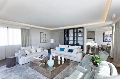 a living room with two couches and a table at REF 1238 - Cannes Croisette - Sea view apartment for rent in Cannes