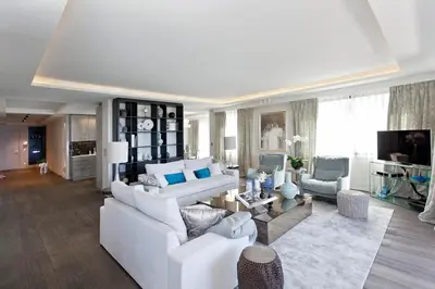 a living room with white couches and a tv at REF 1238 - Cannes Croisette - Sea view apartment for rent in Cannes