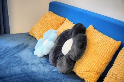 two stuffed animals laying on pillows on a bed at Agréable Studio rue ANIBES-HYPER CENTRE A0B211 in Cannes